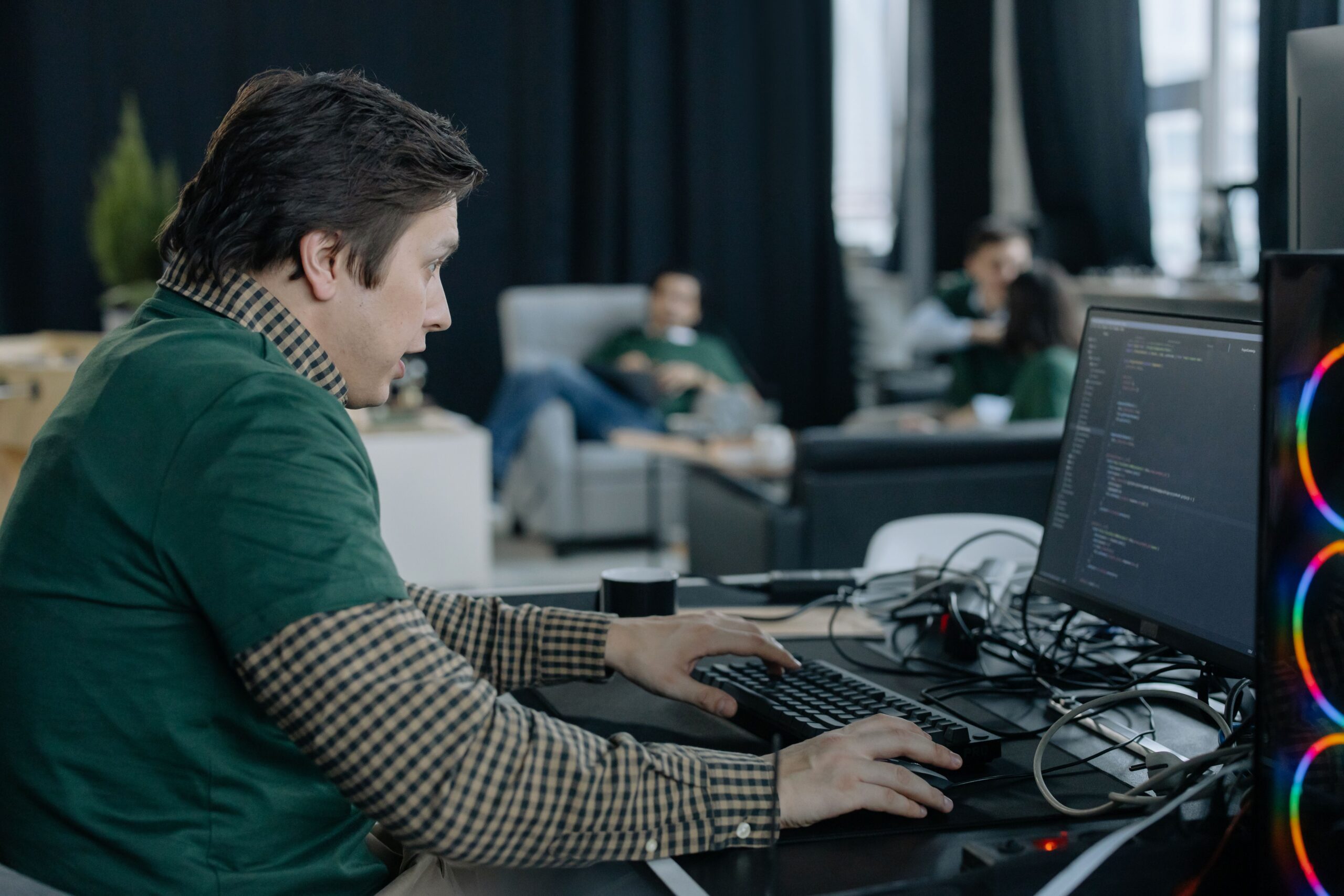 Developer verifying a proof of concept on a computer in an office