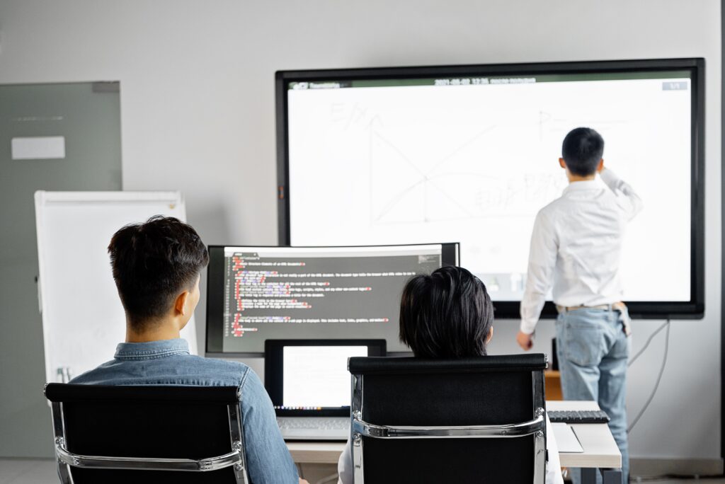 Business presentation connecting the technical side with company goals in a modern office
